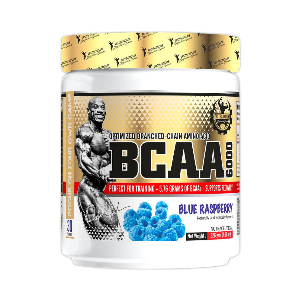 A white plastic tub of BCAA 5000 dietary supplement powder with a gold and white label, featuring a muscular bodybuilder graphic and blue raspberry flavor imagery, set against a plain white background.