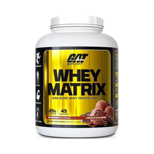 A white plastic tub of GAT SPORT Whey Matrix quad-blend whey protein complex in chocolate ice cream flavor, featuring a metallic gold and black label.