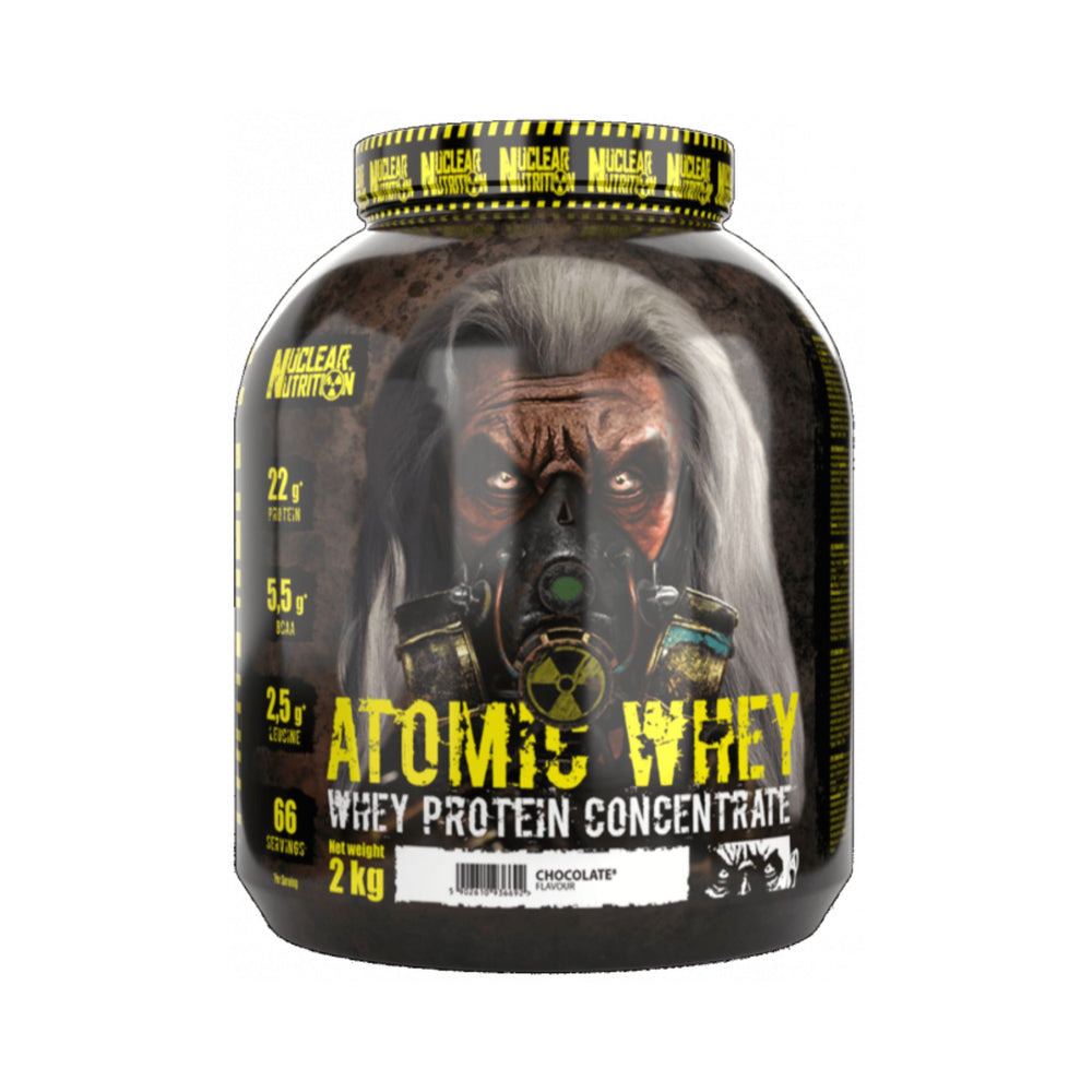 A 2 kg tub of Nuclear Nutrition Atomic Whey Whey Protein Concentrate in Chocolate flavor, featuring a dark, gritty label with a gas mask graphic and yellow text.