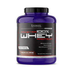 A purple plastic tub of Ultimate Nutrition Prostar 100% Whey Protein in Chocolate Crème flavor, featuring a black label with red and white text, set against a plain white background.
