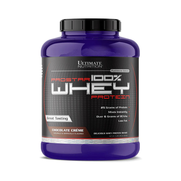 A purple plastic tub of Ultimate Nutrition Prostar 100% Whey Protein in Chocolate Crème flavor, featuring a black label with red and white text, set against a plain white background.